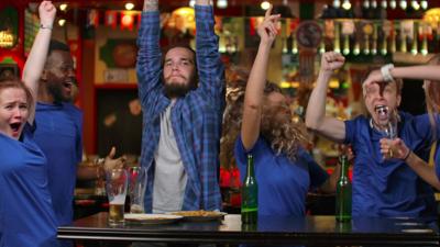 soccer fans in a bar web .jpg