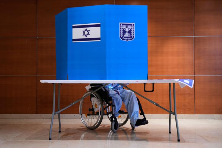 Israelis head to the polls with Netanyahu’s future at stake, in photos