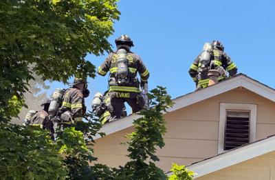 Carson City firefighters on roof