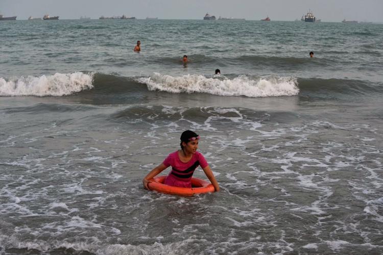 Photos show daily life in Iran on the beach along the Strait of Hormuz