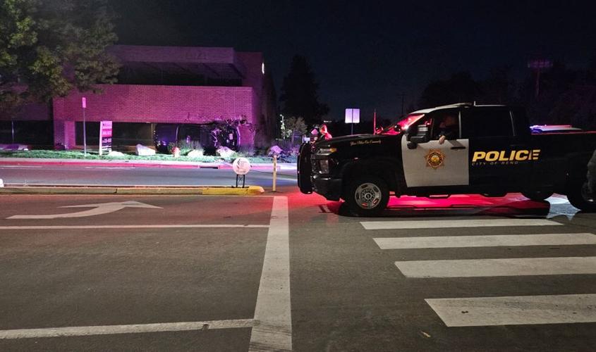 Rollover crash into south Reno building