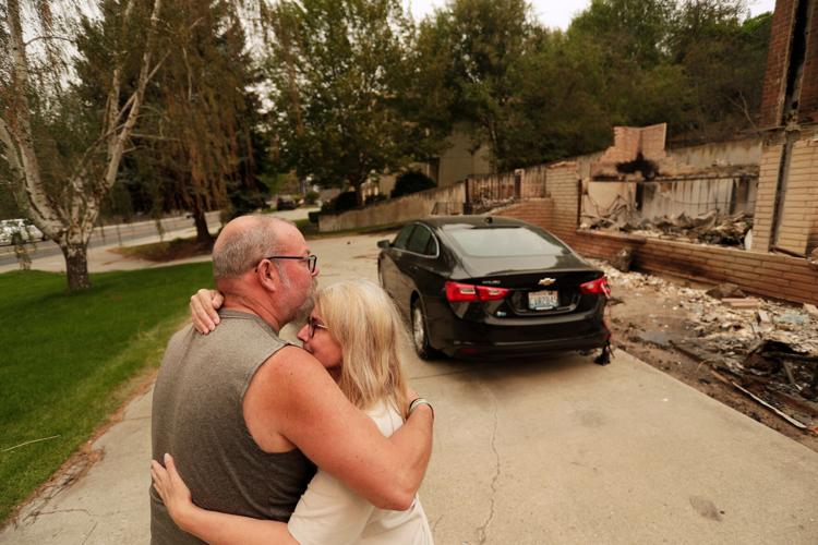 Photos show destruction from wildfires in Greece as blazes take hold in Europe and parts of the US