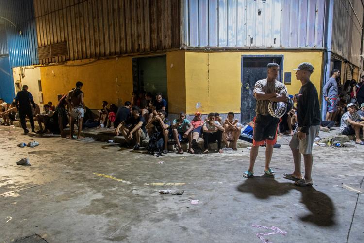 Migrants cross into Spain’s Ceuta enclave from Morocco, in photos