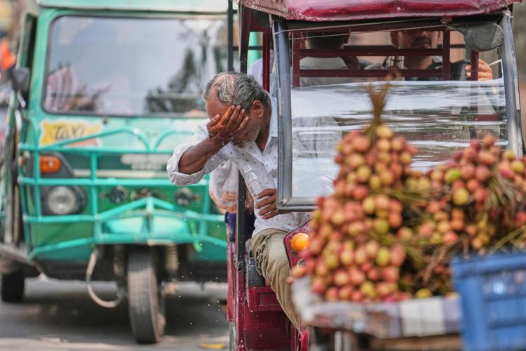 Photos show India sweltering under a severe heat wave