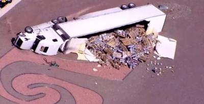 Semi-Truck Rolls Over, Spills Kegs on Phoenix Freeway