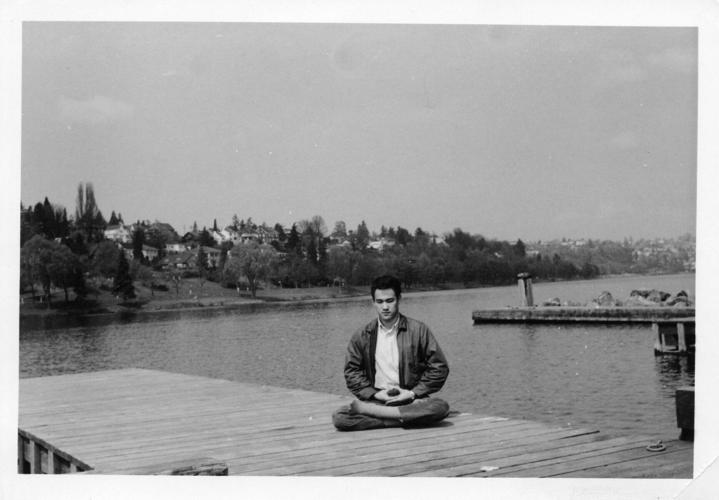 Bruce Lee meditates on a pier on Lake Washington - Bruce Lee Foundation.tif