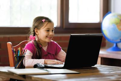 Young girl in remote learning