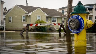 Road-closed-1200x800 A fire hydrant and and “road closed” sign are submerged in water in Ocean City following a nor’easter on Sept. 27, 2026. (Nick DiCicco).jpg
