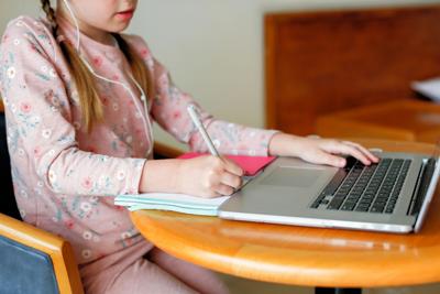 GIRL AT COMPUTER REMOTE LEARNING