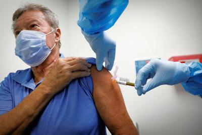 older person getting covid shot
