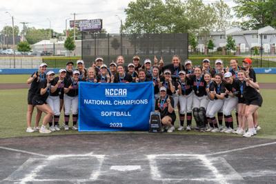 Concordia Ann Arbor poses with NCCAA championship banner