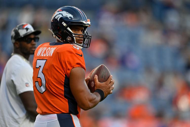 Broncos Wire - Russell Wilson in a Denver Broncos uniform 