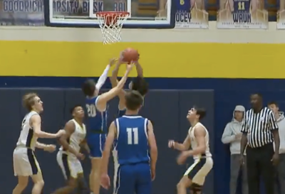 Lake Fenton and Goodrich players battle for the rebound