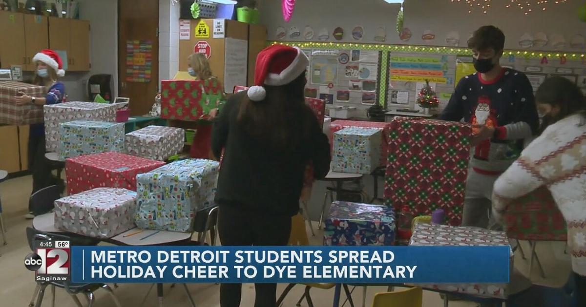 Walled Lake Northern High School students help spread holiday cheer to Dye Elementary students in Flint Township