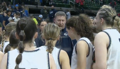 Hemlock coach Scott Neumeyer speaks to his team after winning state semis against Holt
