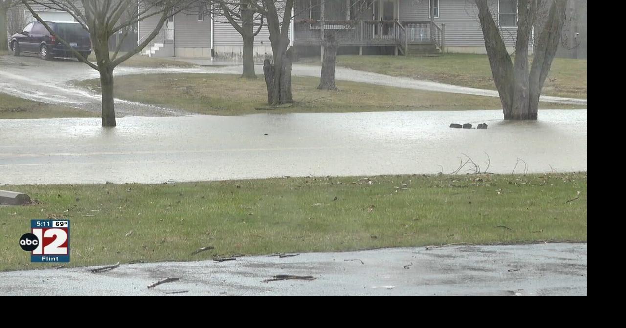 Genesee County Road Commission installing a new drain pipe on Gibson