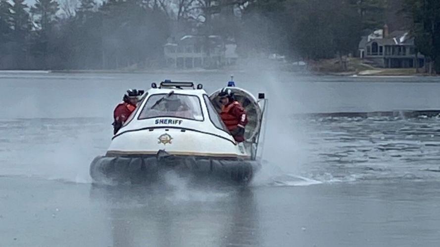Swan stuck in ice rescued from Oakland County lake | Regional Swan stuck in ice rescued from Oakland County lake | Regional
