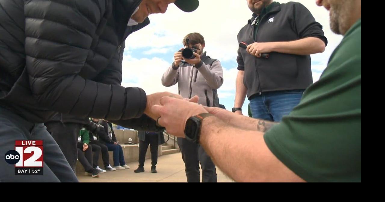 MSU President tours Mid-Michigan, releases sturgeon
