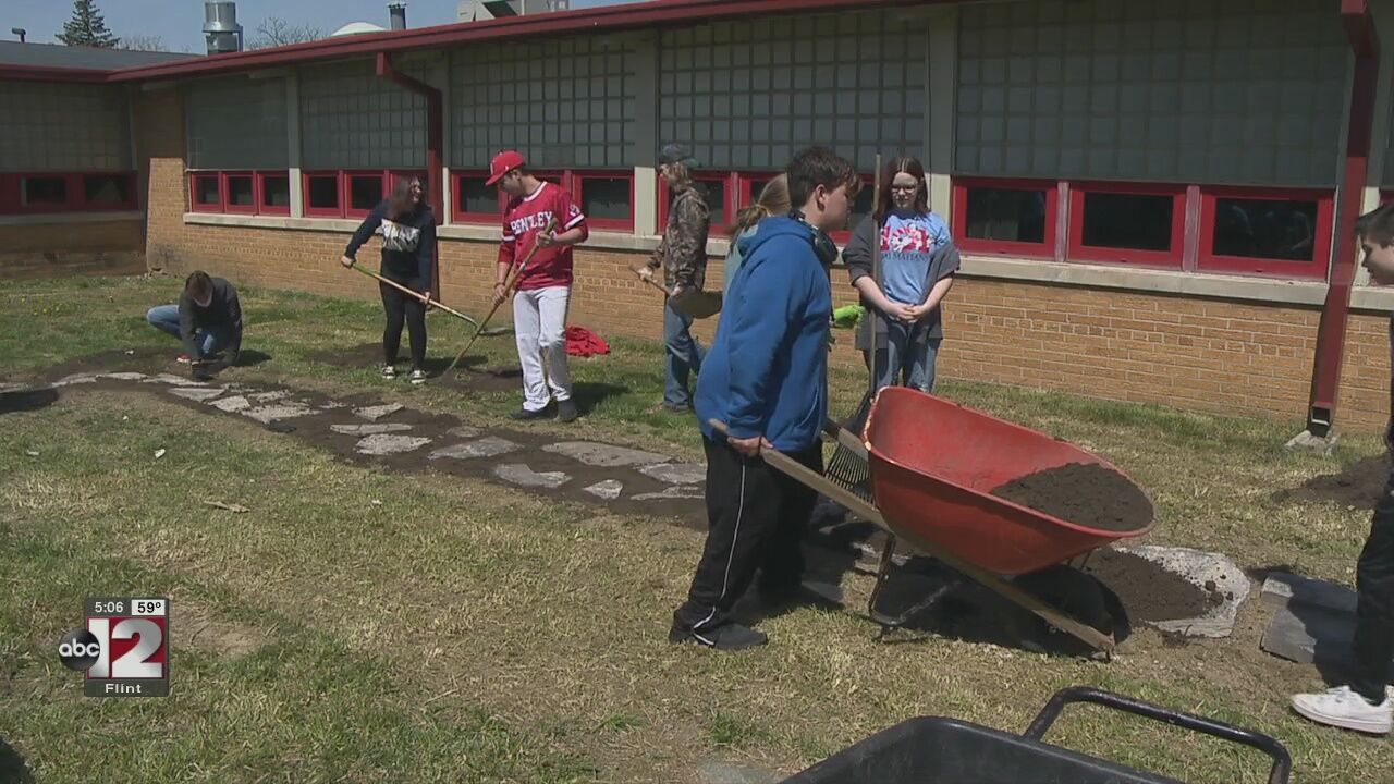 Bentley High School students did their part by cleaning up a courtyard on Youth Global Service Day