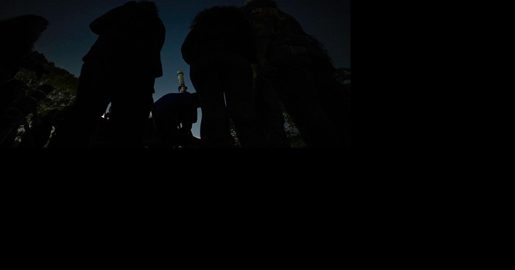 Total lunar eclipse turning the moon reddish-orange Tuesday