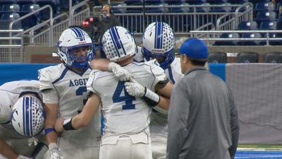 Beal City hugs each other after state championship lose to Hudson, 14-7