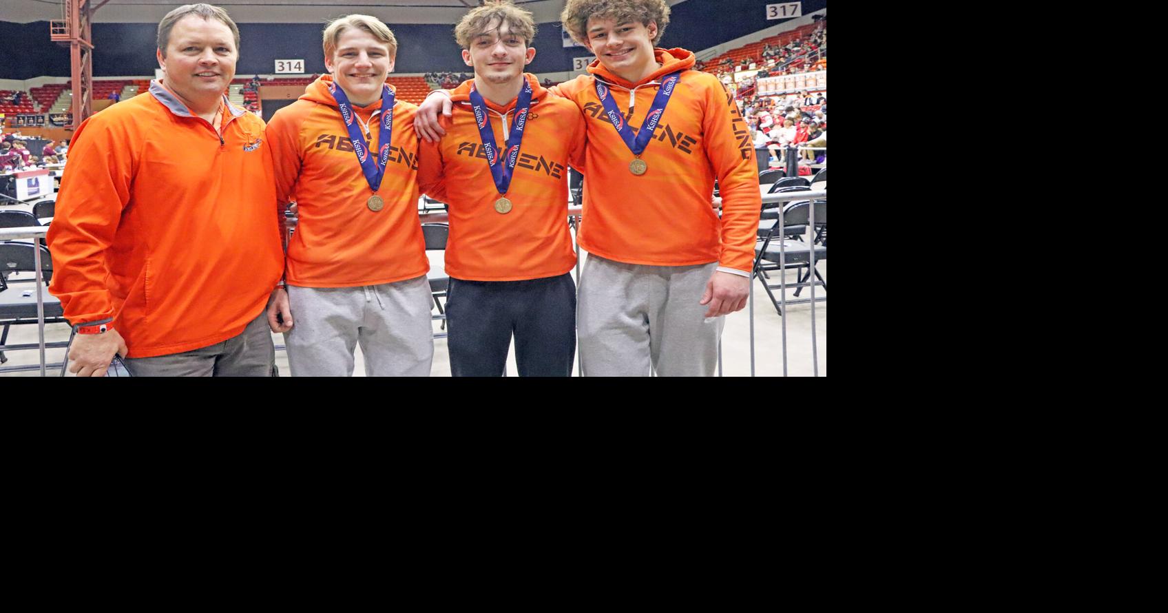 James Stout with third place state finishers Tucker Cell, Christopher