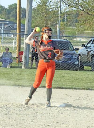 Haylee Anguaino prepares to throw a runner out at first base