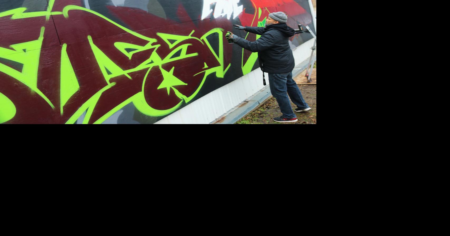 Graffiti artists team up to paint new mural