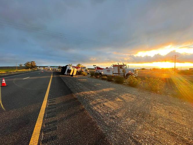 Crash involving overturned semi truck and trailer shuts down fast lane ...