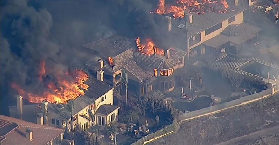 Coastal Fire destroys at least 20 homes in Orange County, California, as hundreds are evacuated