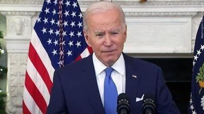 Biden urges concern, not alarm as omicron surges