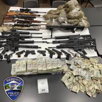 Almost half million in cash and firearms seized during cannabis raids in Redding