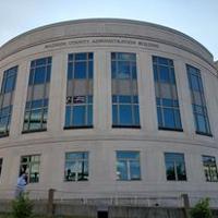Public speakers condemn Slusser at meeting