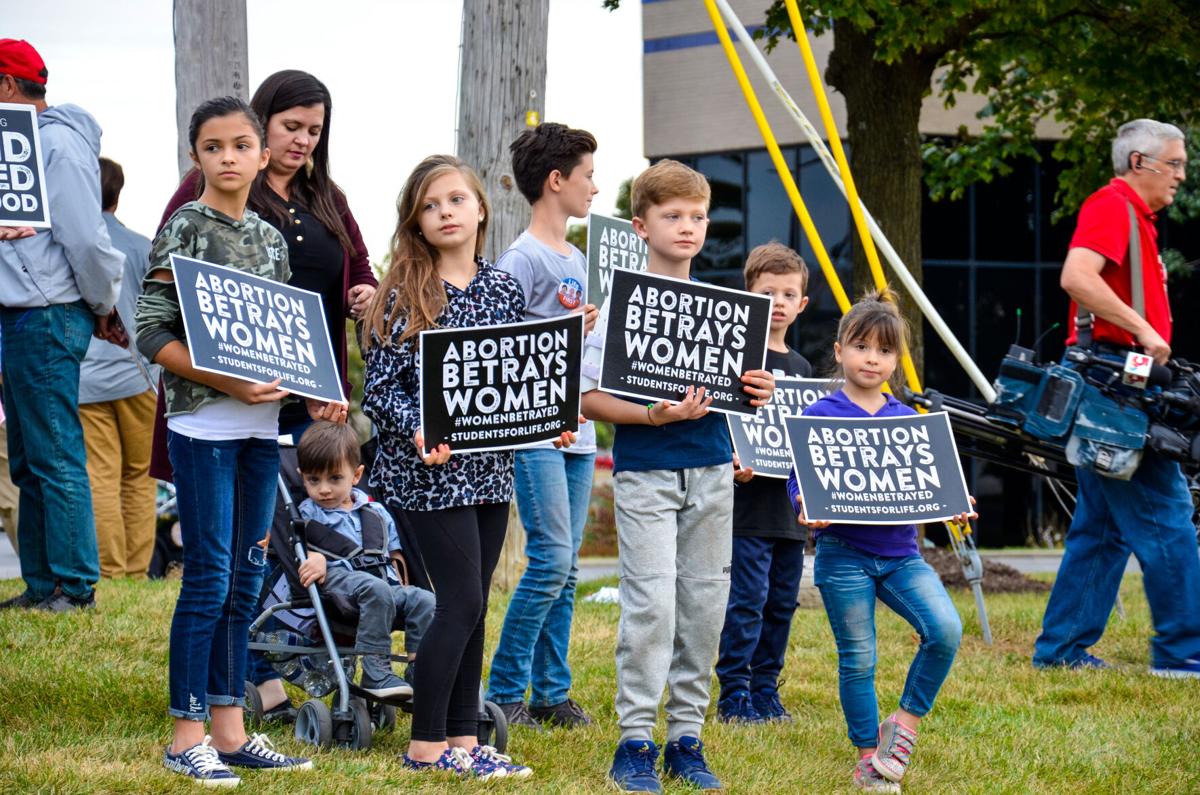 Children join anti-abortion protest outside Planned Parenthood clinic in 2019