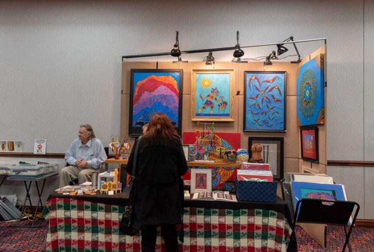 Metal, wood, leather artwork up for sale at Native American Holiday Market