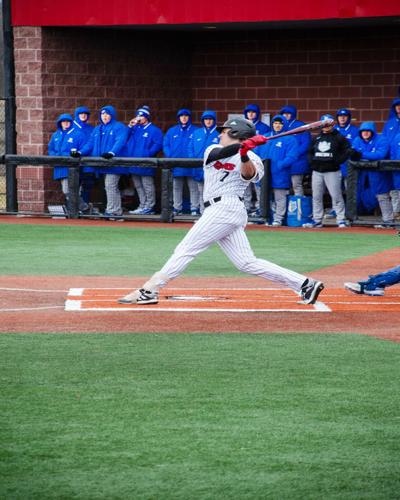 Junior outfielder Braedyn Brewer of Overland Park, Kansas, slams the ball in this February 22 game shortly before the game was suspended due to weather related issues.