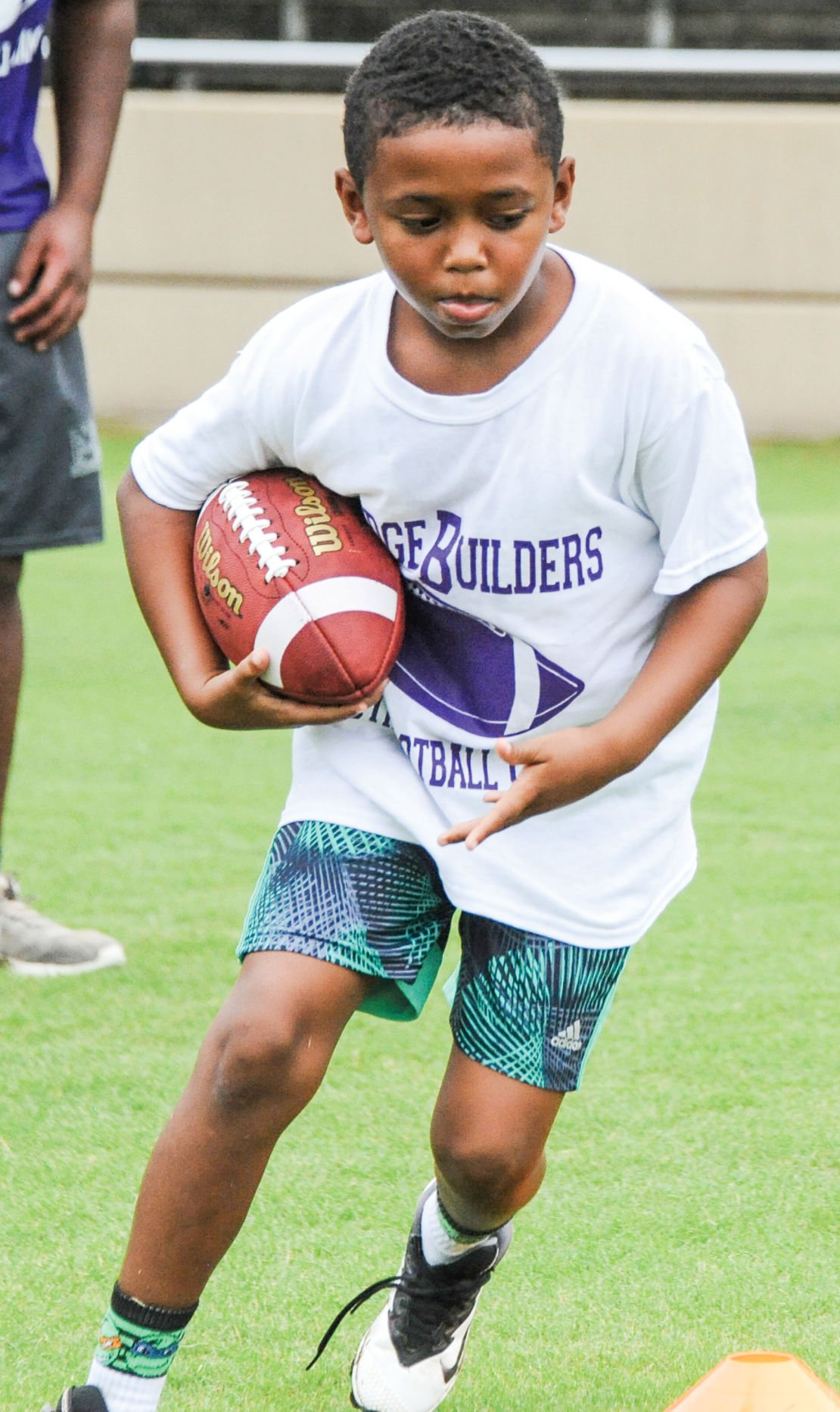 PHOTOS Auburn players visit Bridge Builders youth football camp in