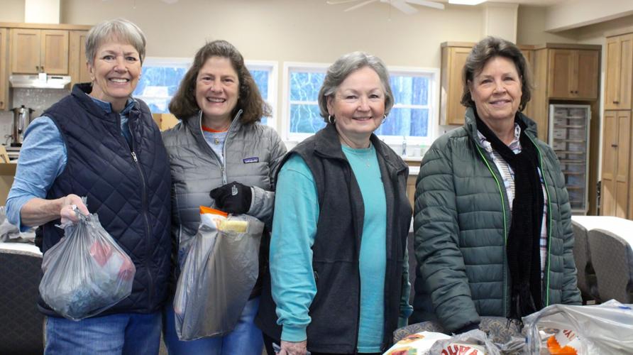 Abigail Murphy / TPI Volunteers pack up food bags with what East Alabama Food Bank delivers that morning by the truckload.