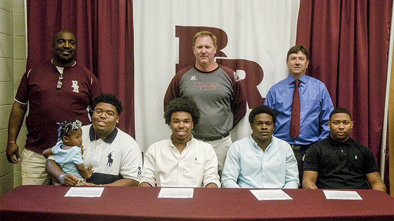 Four Benjamin Russell Football Players With Hocking College