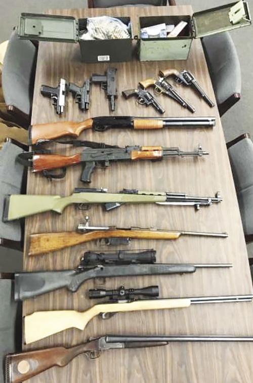 Embezzlement investigation leads to seizure of firearms, arrest
