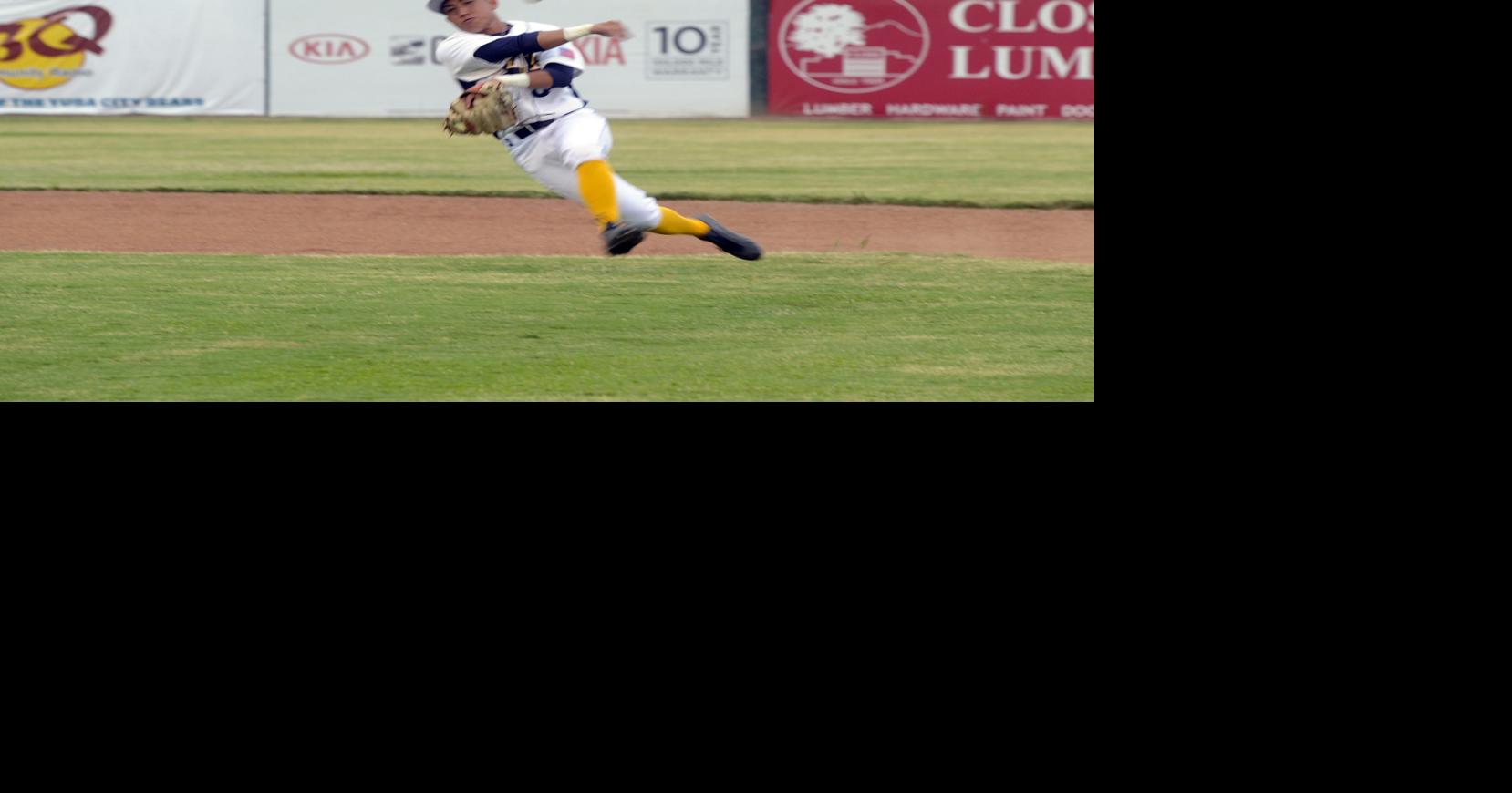 Usa California San Bernardino Baseball Player Sitting In Dugout