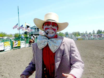 Cowboy Clown With Bright Red Boots And A Giant Green Stetson At