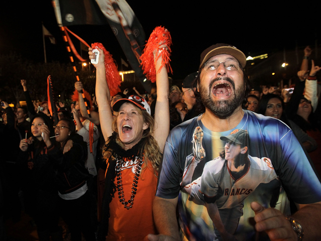 Pat Burrell, Brian Wilson and Aubrey Huff begin the celebration as