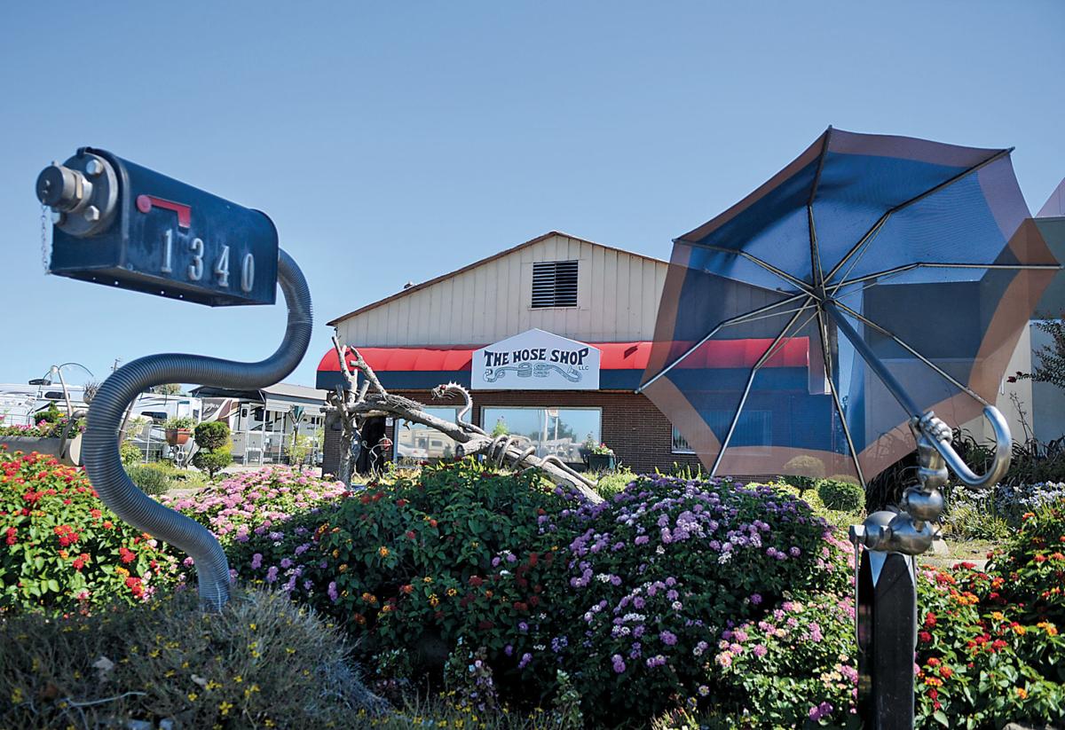 Behind his little shop of hoses News