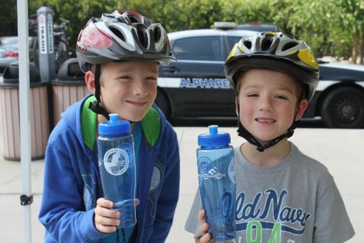 Helmets, water bottles promote bike safety News