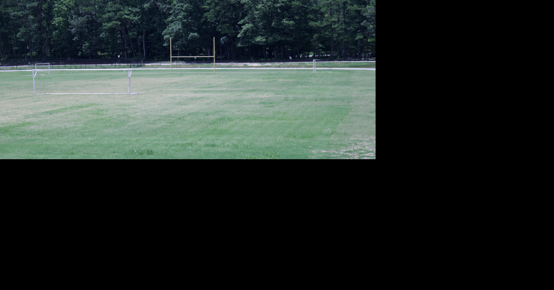 New grass sets in at Dunwoody's Peachtree Middle School with fencing
