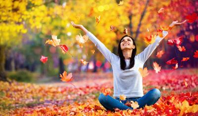 Happy Woman Enjoying Life in the Autumn