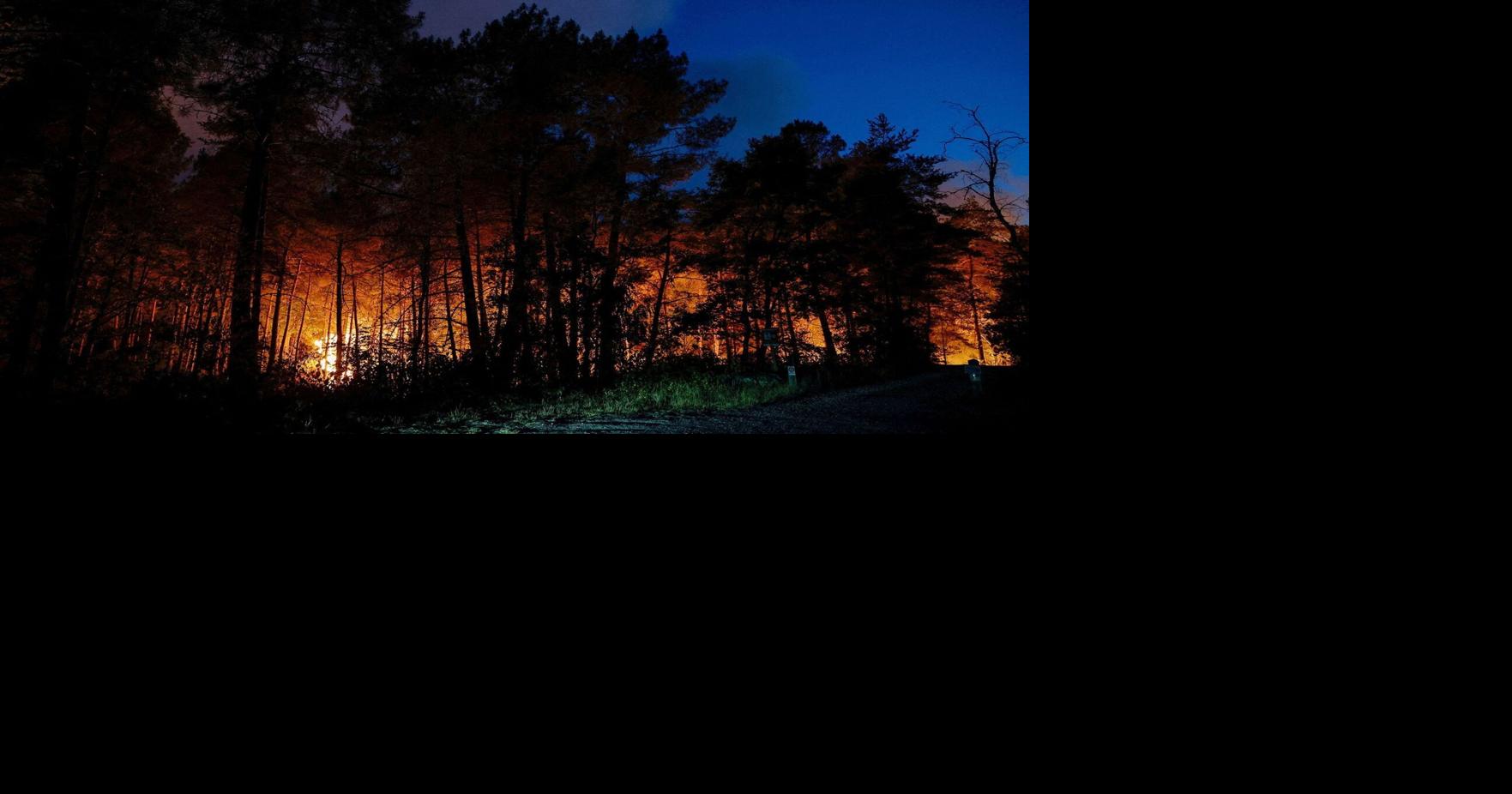 Planes scoop up water from River Seine to battle wildfire near Paris