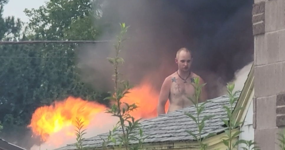 Man arrested after Kennewick RV fire, standoff on burning roof