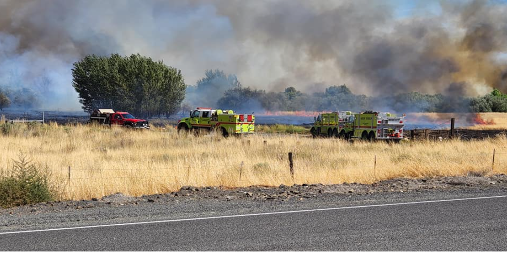 Several crews battle brush fire in Finley, Level 3 evacuations lifted